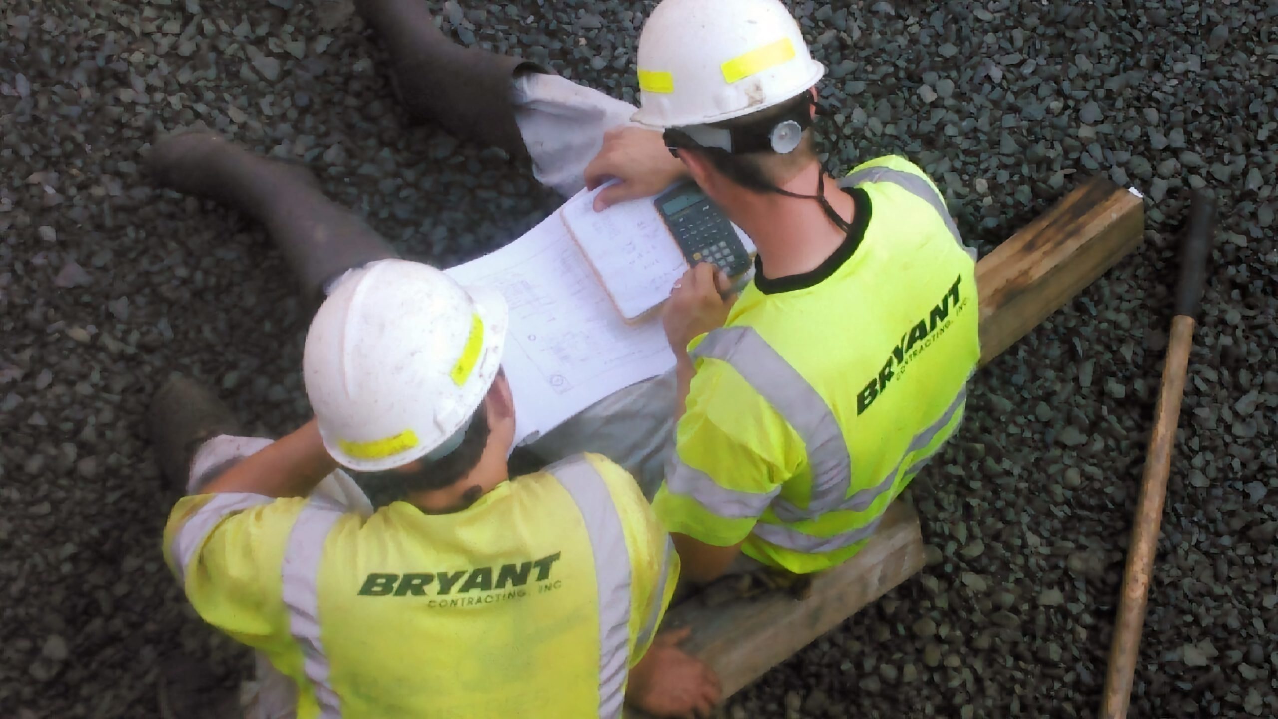 Daniel and Taylor Reviewing Plans Bryant Contracting crew reviewing plans